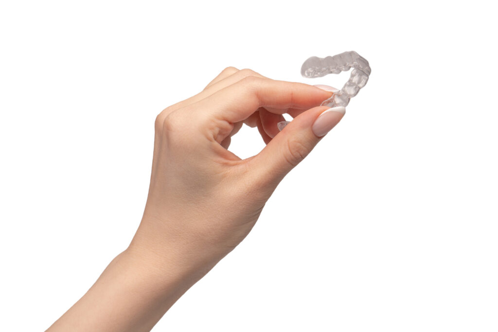 Mouth guard in woman's hand