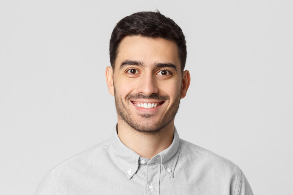 Close up portrait of young smiling handsome man
